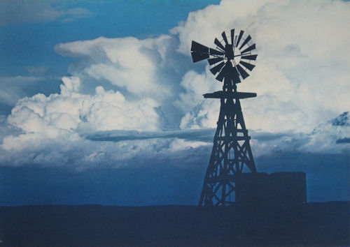 an old Monitor windmill on a wooden tower